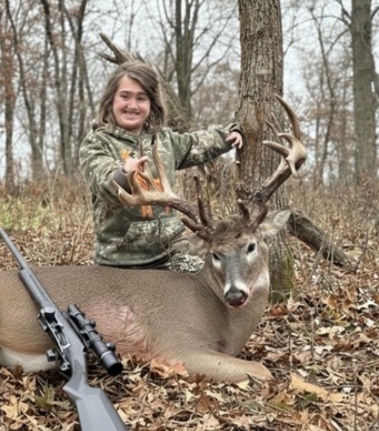 Young hunter with her trophy buck